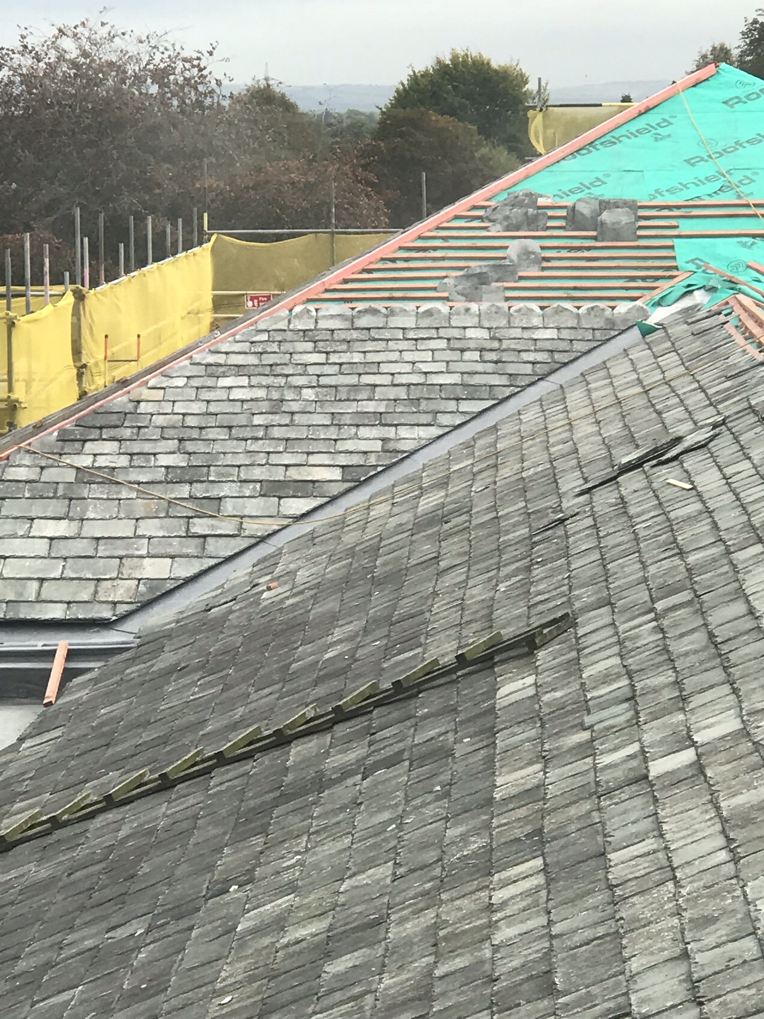 Traditional diminishing slate roof using reclaimed slates