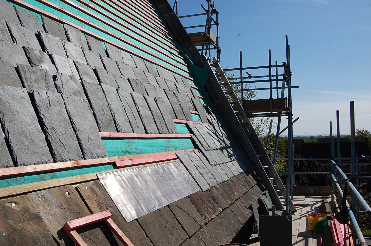 Close view of diminishing courses on a traditional slate roof