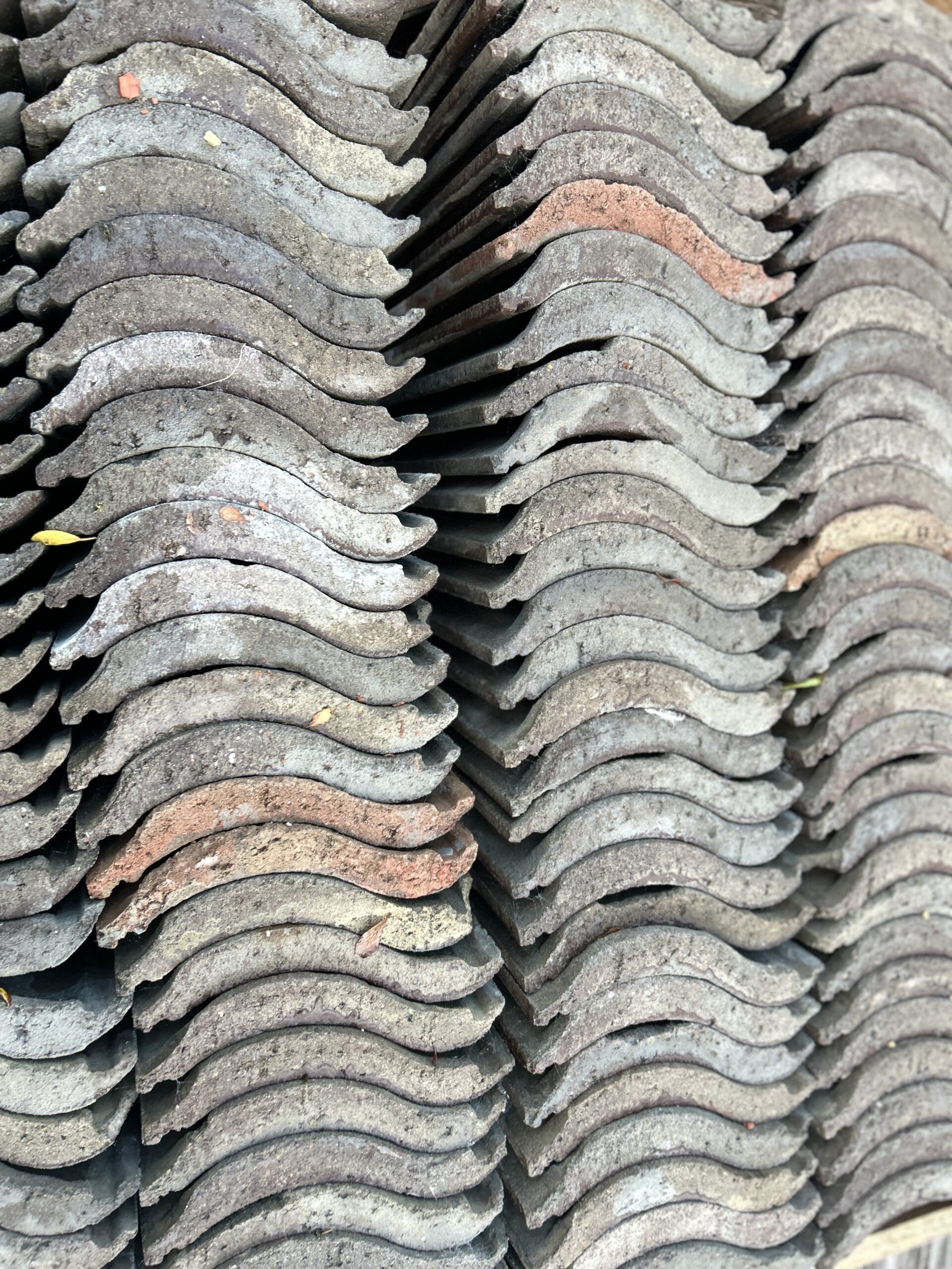Concrete roofing tiles stacked in the yard at The Reclaimed Company