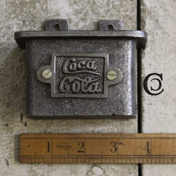 Alternative view of Plaque COKE Fits Cap Catcher Cast Antique Iron
