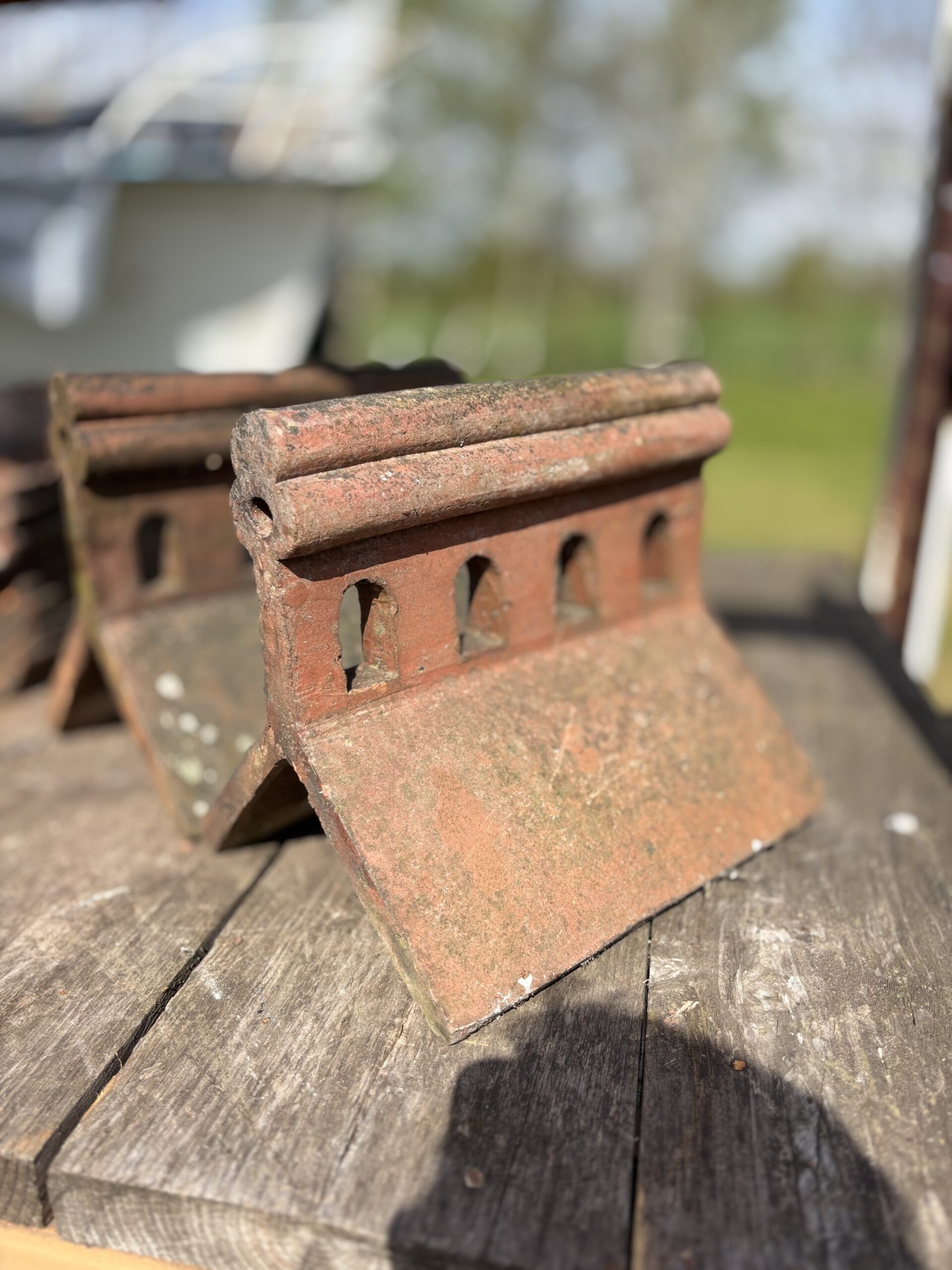 Stacks of reclaimed roofing tiles in a reclamation yard
