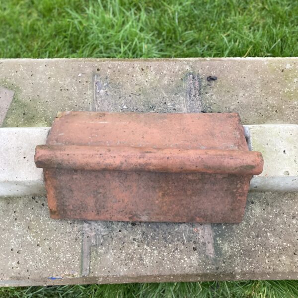 Alternative view of Reclaimed Weathered Terracotta Roll Top Ridge Tile 460-270
