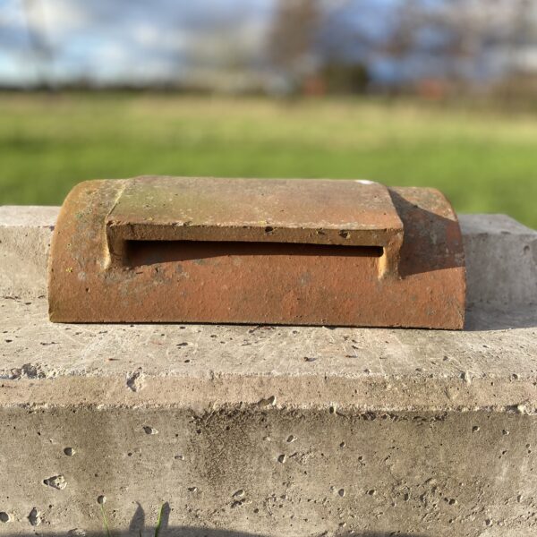Reclaimed half round vent ridge tile.